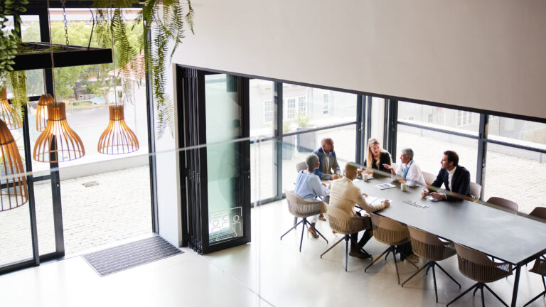 Diverse businesspeople talking during a meeting in an office boardroom