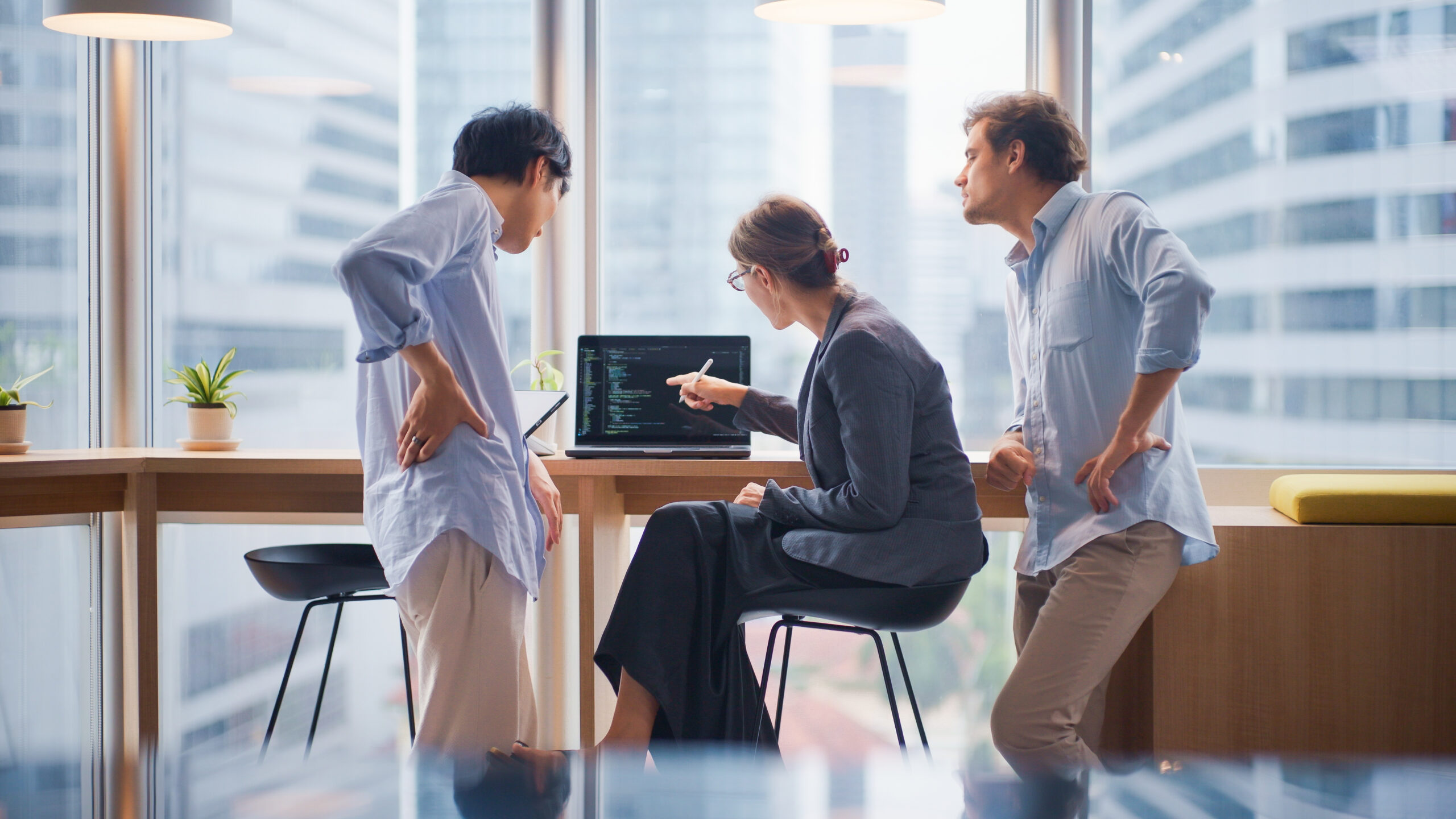 Startup team having a brainstorming session on coding strategies