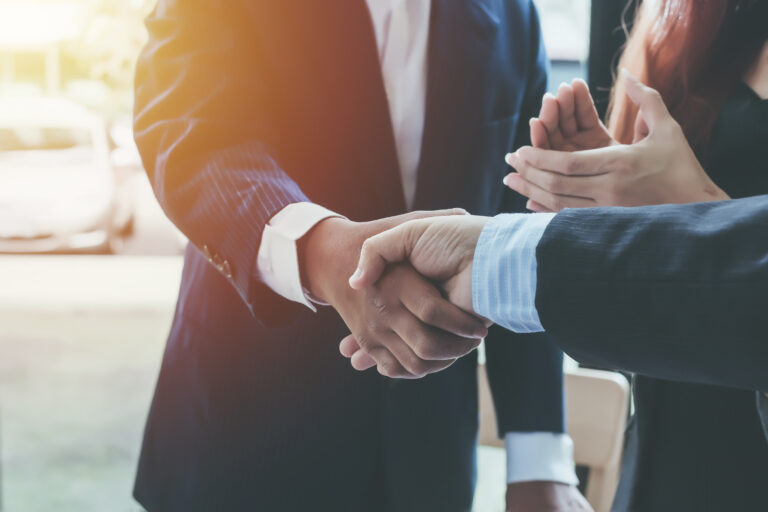Business shaking hands. Business executives to congratulate the joint